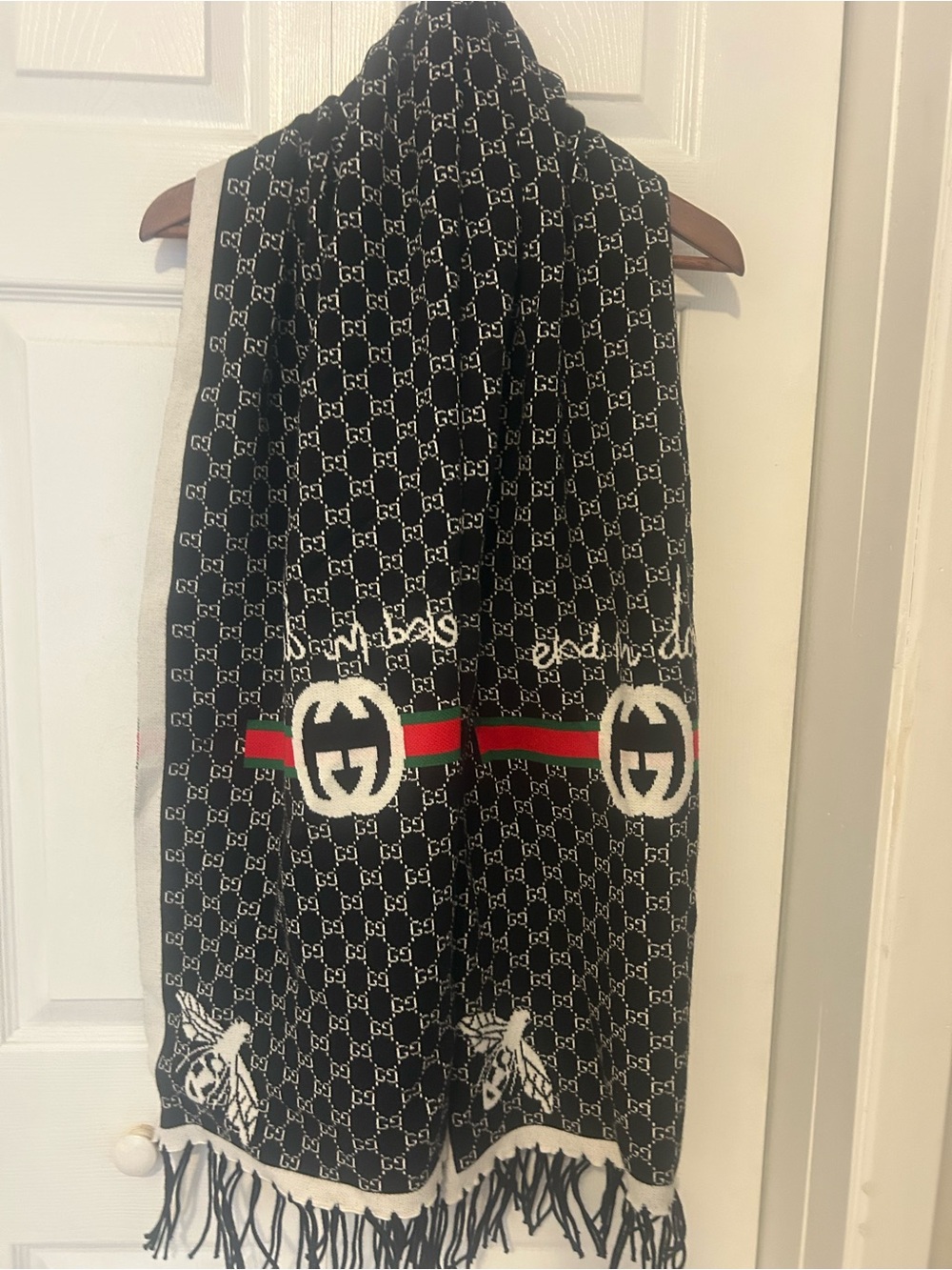 Black Logo Knit Scarf bolero with Red & Green Stripe